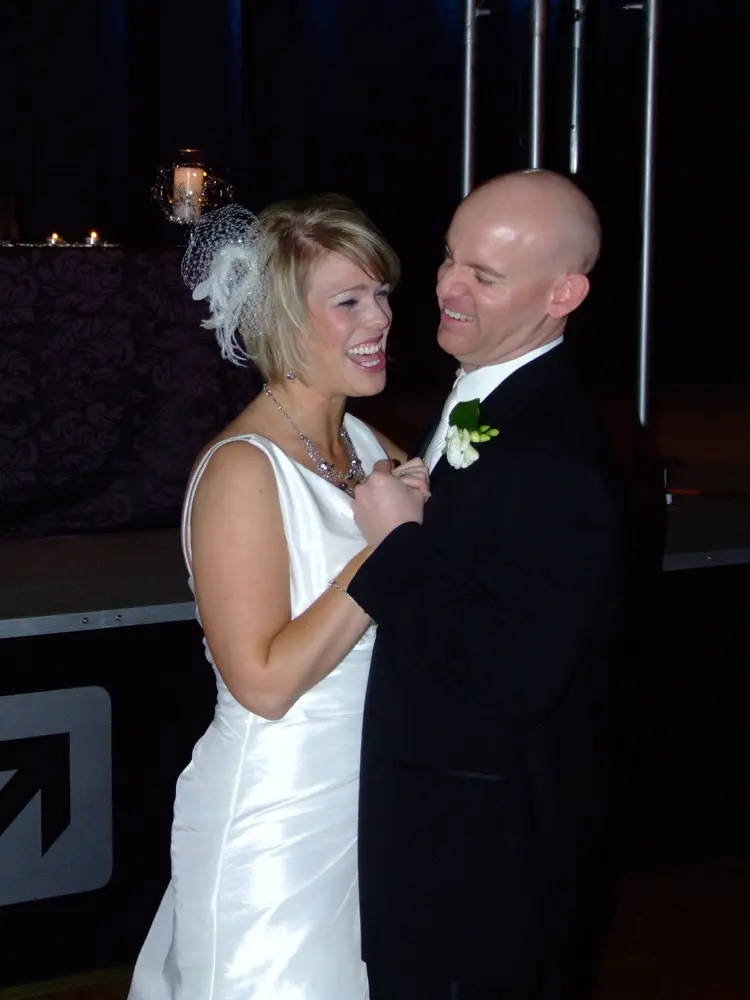 A bride and groom sharing a dance at their reception